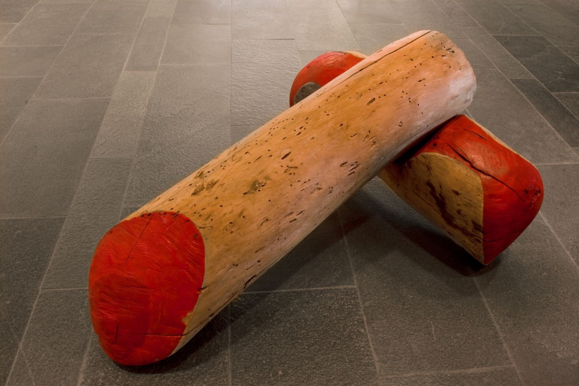 Two logs, one on top of the other.